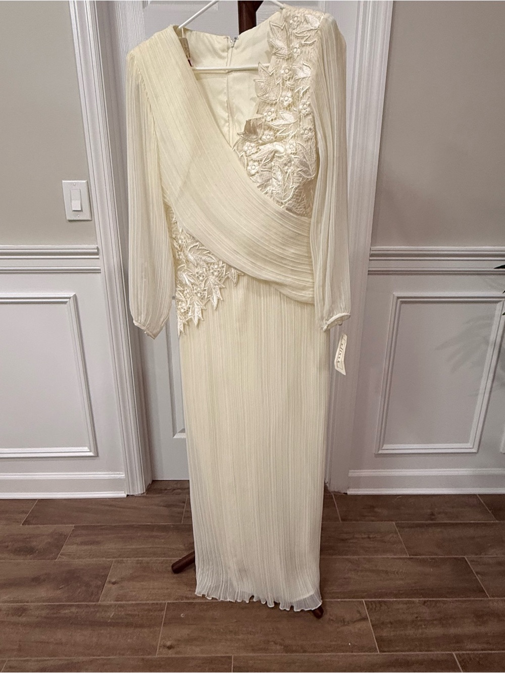 Melissa Ivory Long-Sleeve Pleated Gown with Floral Appliqué